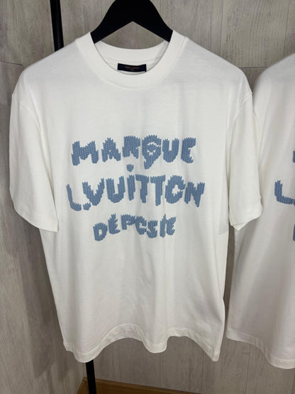 L CAMISETA