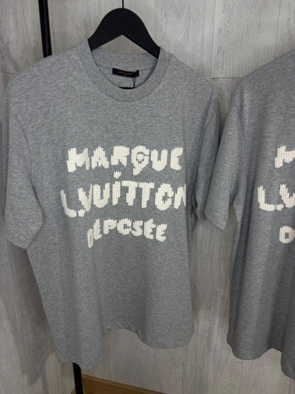 L CAMISETA